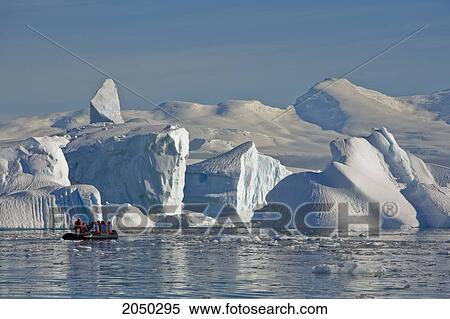 Travelers Pass Gigantic Icebergs In Wilhelmina Bay Off Enterprise Island In The Antarctic Peninsula View Large Photo Image Stock Photography - Travelers Pass Gigantic Icebergs In Wilhelmina Bay Off Enterprise Island In The Antarctic Peninsula. Fotosearch