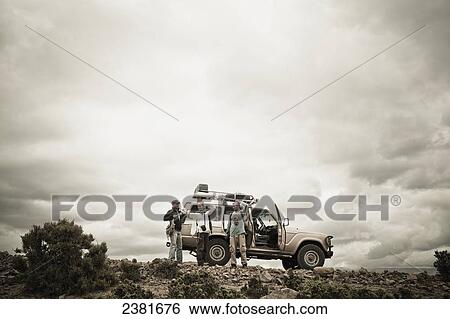 Travellers beside their four wheel drive vehicle in the Simien mountains; Ethiopia View Large Photo Image Stock Photograph - Travellers beside their four wheel drive vehicle in the Simien mountains; Ethiopia. Fotosearch
