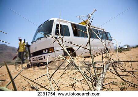 Picture - Travellers with their bus stuck in the sand near the Gheralta plateau; Tigray region, Ethiopia. Fotosearch