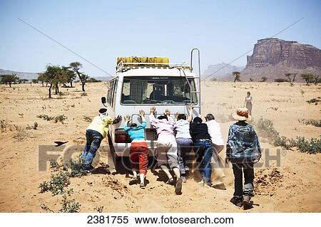 Travellers with their bus stuck in the sand near the Gheralta plateau; Tigray region, Ethiopia View Large Photo Image Stock Photography - Travellers with their bus stuck in the sand near the Gheralta plateau; Tigray region, Ethiopia. Fotosearch