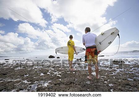 Stock Image - Travelling Surfers In Tanzania, East Africa.. Fotosearch