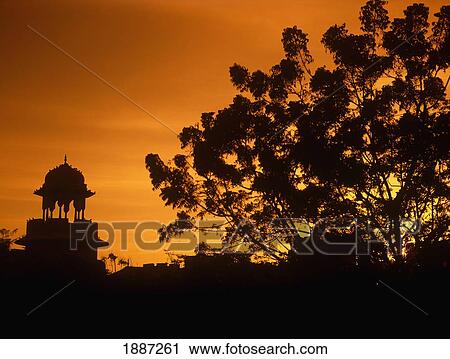 Stock Image - Tree And Dome Silhouetted At Sunset. Fotosearch