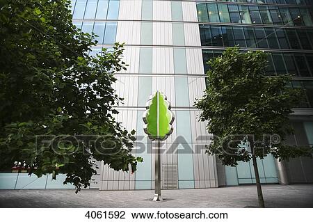 Stock Image - Tree sculpture set amongst the modern office buildings of MoreLondon near the River Thames and South Bank; London, England. Fotosearch