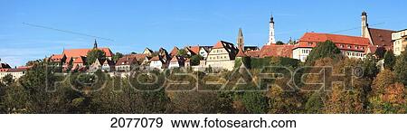 Trees And Buildings Against A Blue Sky; Rothenburg Ob Der Tauber Bavaria Germany View Large Photo Image Stock Photo - Trees And Buildings Against A Blue Sky; Rothenburg Ob Der Tauber Bavaria Germany. Fotosearch