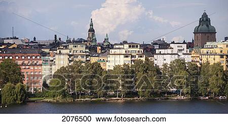Trees And Buildings Along The Water's Edge; Stockholm Sweden View Large Photo Image Stock Image - Trees And Buildings Along The Water's Edge; Stockholm Sweden. Fotosearch