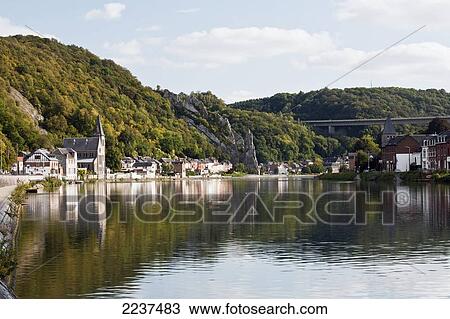 Trees And Buildings Reflected In The Tranquil River Meuse; Dinant Namur Belgium View Large Photo Image Stock Image - Trees And Buildings Reflected In The Tranquil River Meuse; Dinant Namur Belgium. Fotosearch