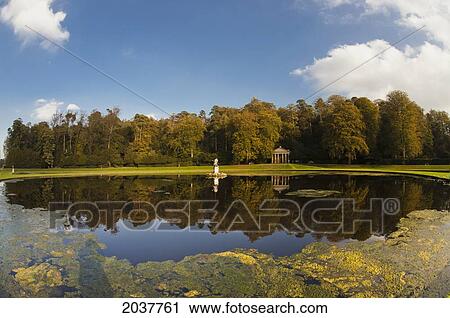 Trees Reflected In The Tranquil River Water; Studley North Yorkshire England View Large Photo Image Stock Image - Trees Reflected In The Tranquil River Water; Studley North Yorkshire England. Fotosearch