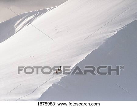 Stock Photo - Trekking Up Snowy Mountain. Fotosearch