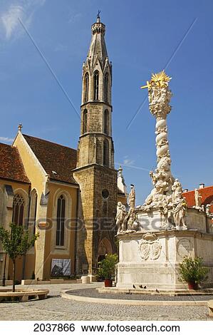 Stock Photograph - Trinity Column And The Goat Church In The Old Town Of Sopron; Gyor-Moson-Sopron Hungary. Fotosearch