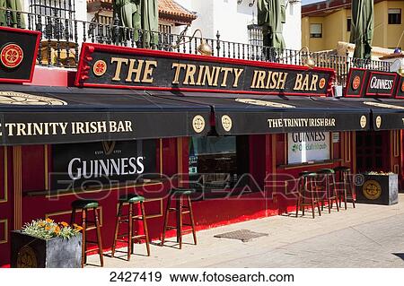 Trinity Irish Bar; Chipiona, Andalusia, Spain View Large Photo Image Stock Photo - Trinity Irish Bar; Chipiona, Andalusia, Spain. Fotosearch