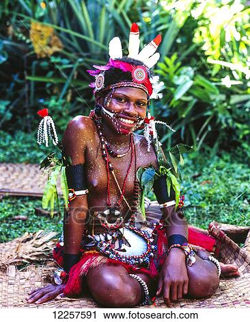 Stock Image - Trobriand Island woman in traditional attire; Trobriand Islands, Papua New Guinea. Fotosearch