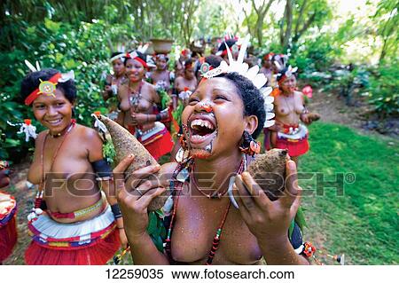 Trobriand Island women in traditional costume carrying yams; Trobriand Islands, Papua New Guinea View Large Photo Image Stock Photography - Trobriand Island women in traditional costume carrying yams; Trobriand Islands, Papua New Guinea. Fotosearch