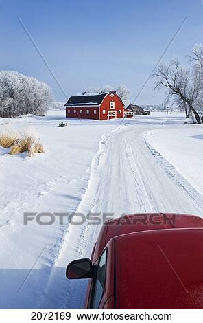 Stock Photo - Truck Along Country Lane With Red Barn In Background In Winter, Near Oakbank, Manitoba. Fotosearch