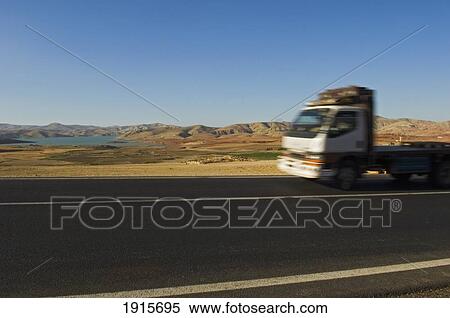 Stock Photography - Truck On Desert Highway. Fotosearch