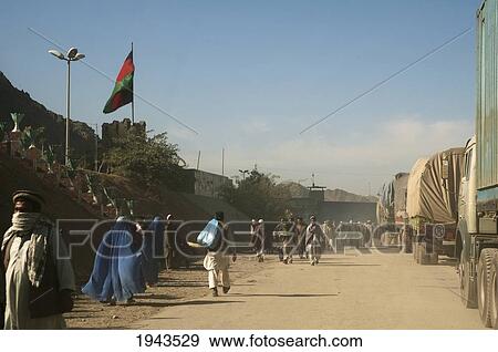 Trucks And People Crossing The Border To Pakistan At Torkham, Nangarhar Province, Afghanistan View Large Photo Image Stock Photo - Trucks And People Crossing The Border To Pakistan At Torkham, Nangarhar Province, Afghanistan. Fotosearch