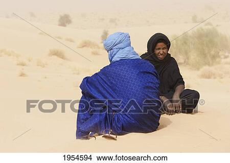 Picture - Tuareg couple on a sand dune near Timbuktu, Mali. Fotosearch