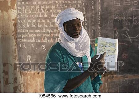 Tuareg teacher in a primary school in Tiriken, Mali View Large Photo Image Stock Photograph - Tuareg teacher in a primary school in Tiriken, Mali. Fotosearch