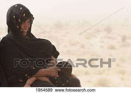 Tuareg woman and child on a sand dune near Timbuktu, Mali View Large Photo Image Stock Photo - Tuareg woman and child on a sand dune near Timbuktu, Mali. Fotosearch