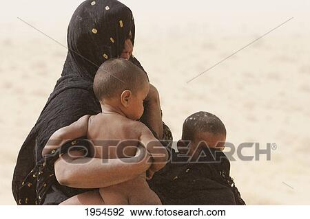 Tuareg woman on a sand dune near Timbuktu, Mali View Large Photo Image Stock Image - Tuareg woman on a sand dune near Timbuktu, Mali. Fotosearch