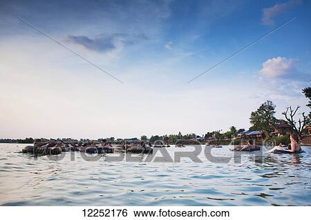Tubing on the Mekong River; Si Phan Don, Laos View Large Photo Image Stock Photograph - Tubing on the Mekong River; Si Phan Don, Laos. Fotosearch