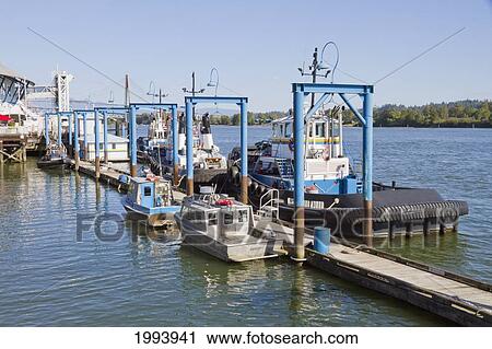 Stock Image - Tug Boat Dock On The Fraser River, New Westminster, British Columbia, Canada. Fotosearch