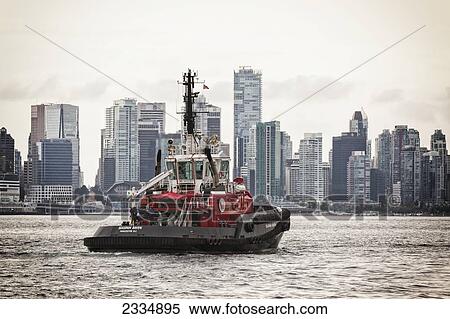 Stock Photography - Tugboat Crossing Burrard Inlet; Vancouver British Columbia Canada. Fotosearch