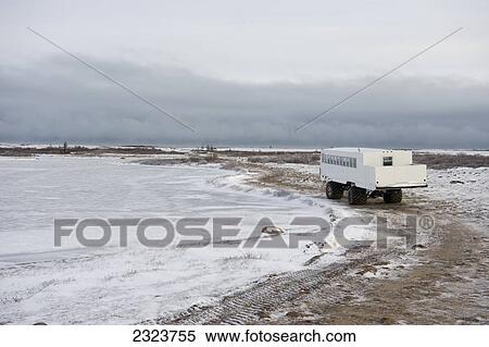 Stock Photography - Tundra buggy on the shore of Hudson Bay; Canada. Fotosearch