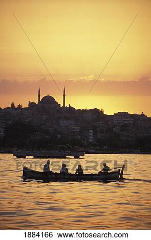Stock Photograph - Turkey, Boat On The Bosphorus At Sunset; Istanbul. Fotosearch