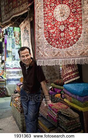 Stock Image - Turkey, Carpet and Rug Vendor in Kapali Carsi (Grand Bazaar) Beyazit; Istanbul. Fotosearch