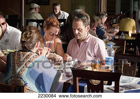 Turkey, Couple Sharing Food In One Of Many Restaurants Which Stretch Along Both Sides Of Galata Bridge; Istanbul View Large Photo Image Picture - Turkey, Couple Sharing Food In One Of Many Restaurants Which Stretch Along Both Sides Of Galata Bridge; Istanbul. Fotosearch