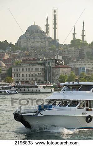 Stock Image - Turkey, Ferries crossing Golden Horn with Suleymaniye Mosque behind; Istanbul. Fotosearch