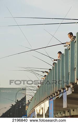 Stock Image - Turkey, Fishermen on Galata Bridge; Istanbul. Fotosearch