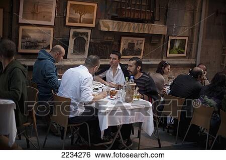 Stock Photograph - Turkey, Istanbul, People Eating In Restaurant On Sofyali Sokak; Beyoglu. Fotosearch