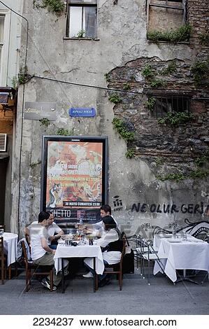 Stock Photo - Turkey, Istanbul, People In Restaurant At Sofyali Sokak; Beyoglu District. Fotosearch