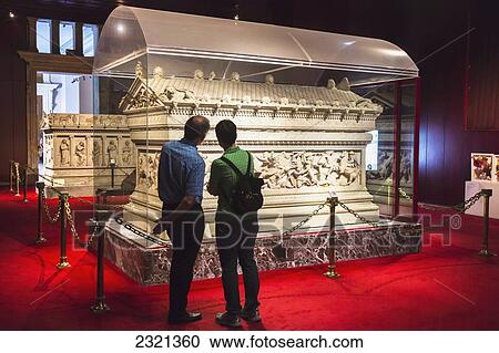 Stock Image - Turkey, Istanbul Province, Istanbul, Tourists in archaeological museum. Fotosearch