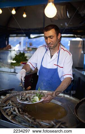 Stock Photo - Turkey, Istanbul, Small Restaurants Fry Up Freshly Caught Catch On Shores Of Karakoy Fish Market; Karakoy. Fotosearch
