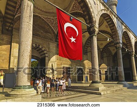 Stock Photograph - Turkey, Istanbul, Turkish flag at entrance to Blue Mosque. Fotosearch