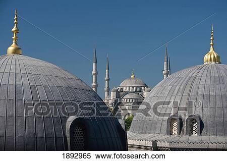Stock Photography - Turkey, Looking across domed roofs of Haghia Sophia to Sultanahmet or Blue Mosque; Istanbul. Fotosearch