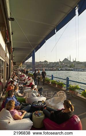 Turkey, Looking along line of bars and restaurants on Galata Bridge with Suleymaniye mosque behind; Istanbul View Large Photo Image Stock Photo - Turkey, Looking along line of bars and restaurants on Galata Bridge with Suleymaniye mosque behind; Istanbul. Fotosearch