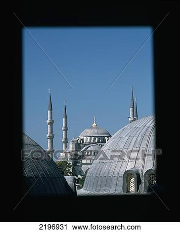 Stock Image - Turkey, Looking out windows and across domed roofs of Haghia Sophia to Sultanahmet or Blue Mosque; Istanbul. Fotosearch