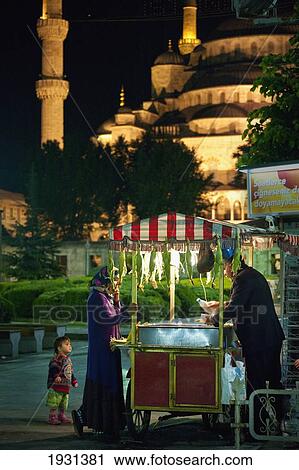 Turkey, Mother and Child Buying From Sweet Corn Seller in Front of Sultanahmet or Blue Mosque at Night; Istanbul View Large Photo Image Stock Image - Turkey, Mother and Child Buying From Sweet Corn Seller in Front of Sultanahmet or Blue Mosque at Night; Istanbul. Fotosearch