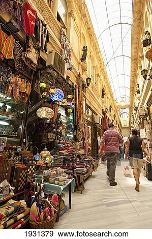 Stock Photo - Turkey, Tourists walking in market; Istanbul. Fotosearch