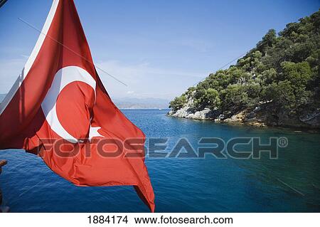 Picture - Turkish Flag On Boat By Coast. Fotosearch