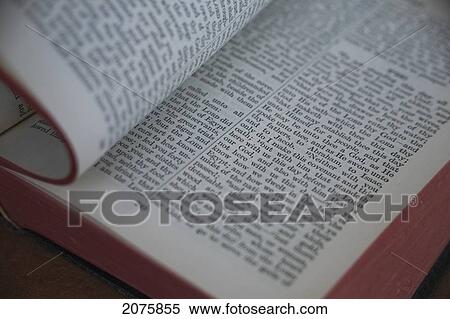 Stock Photography - Turning Page Of The Holy Bible. Fotosearch