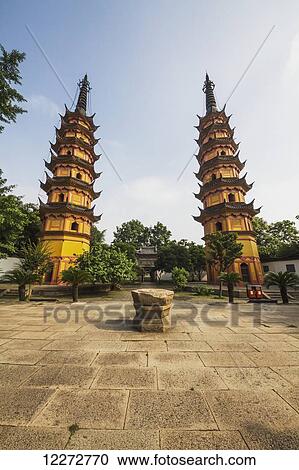 Stock Image - Twin Pagodas dating to the Northern Song Dynasty and remains of the Main Hall of the Arhat Temple, Suzhou, Jiangsu, China. Fotosearch