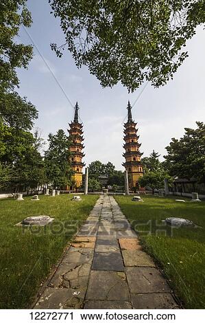 Stock Image - Twin Pagodas dating to the Northern Song Dynasty and remains of the Main Hall of the Arhat Temple, Suzhou, Jiangsu, China. Fotosearch