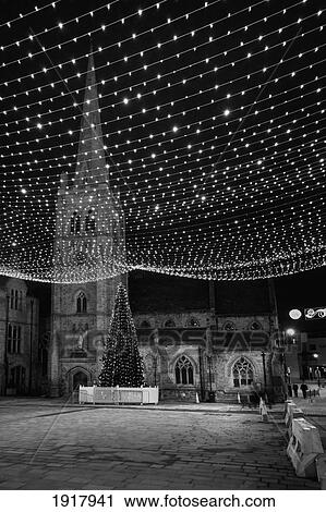 Stock Image - Twinkling Lights By Church At Christmas; Durham, England. Fotosearch