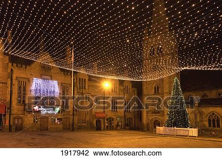 Stock Image - Twinkling Lights By Church At Christmas; Durham, England. Fotosearch