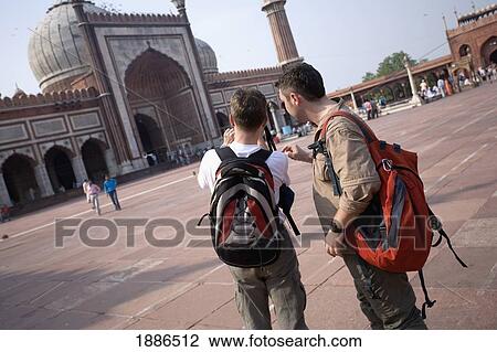 Two Backpackers Taking Pictures At Jama Masjid Mosque View Large Photo Image Stock Image - Two Backpackers Taking Pictures At Jama Masjid Mosque. Fotosearch