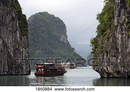 Two Boats Going Through Cliffside Waters View Large Photo Image Picture - Two Boats Going Through Cliffside Waters. Fotosearch